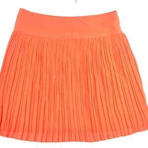 ORANGE MINI PLEATED SKIRT